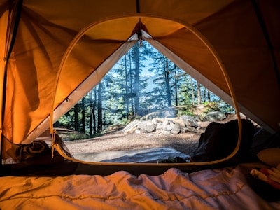 Camping tent setup in forest