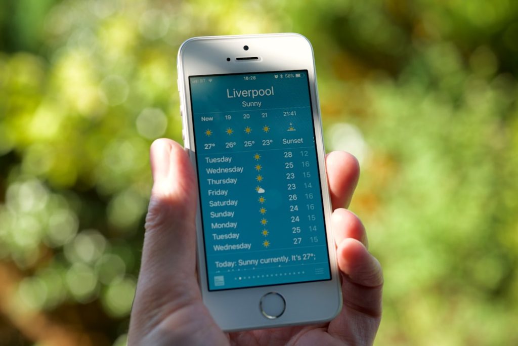 Close-up of a smartphone screen showing a calendar app with multiple RV campground reservation alerts and cancellation deadli